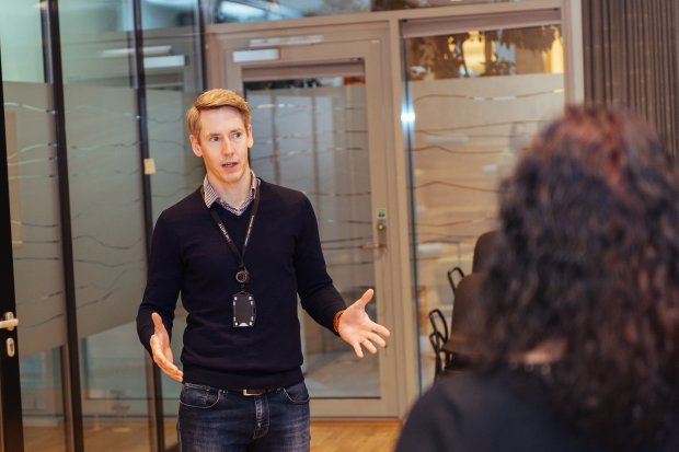 Man having a conversation with colleagues