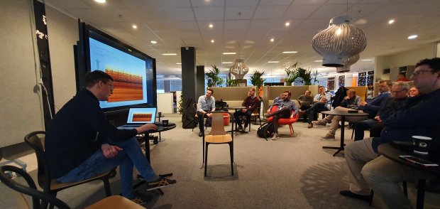 A group of software developers in Equinor during a product demonstration
