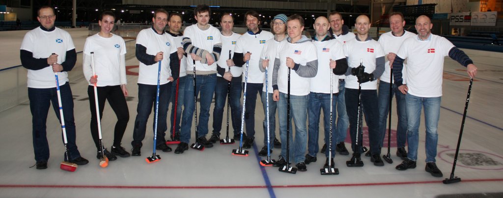 Photo of a group of people standing on a curling rink