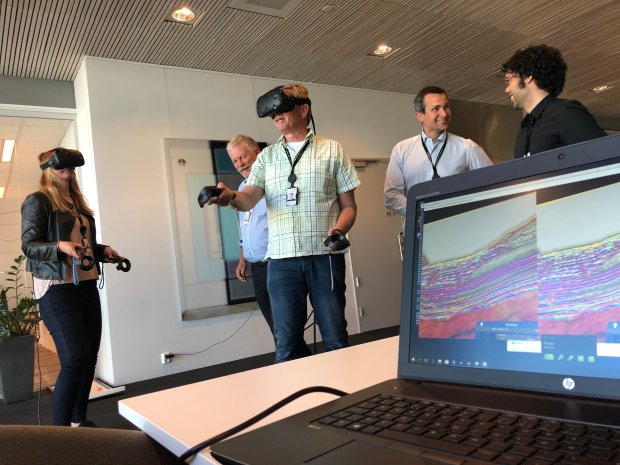 Man wearing a VR headset in a office landscape
